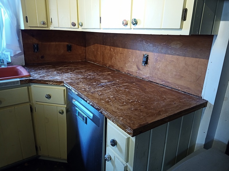 A gross looking counter that has had all the terrible shit removed.