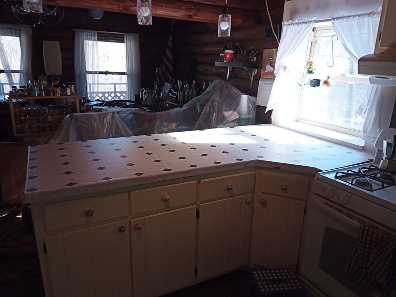 A much nicer looking white and black fake tile countertop.